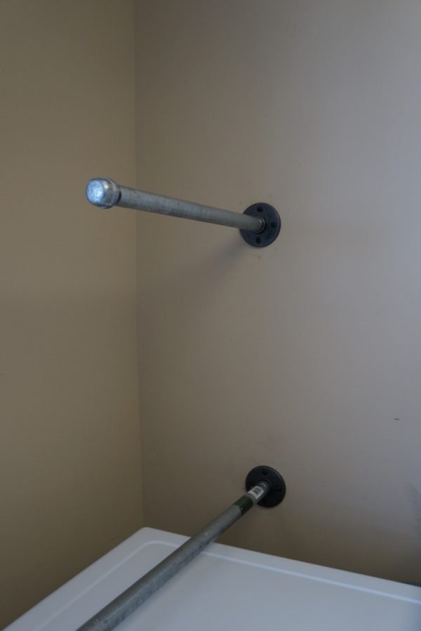 Laundry Room Makevover for under 250! With DIY Rustic Industrial Pipe