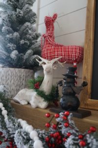 Buffalo check christmas decor black and white stockings with red accents mantle fireplace reindeer red black and white christmas decor