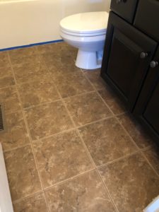 bathroom floors before I stenciled them black and white