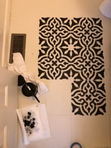 Stenciled floors in black and white paint