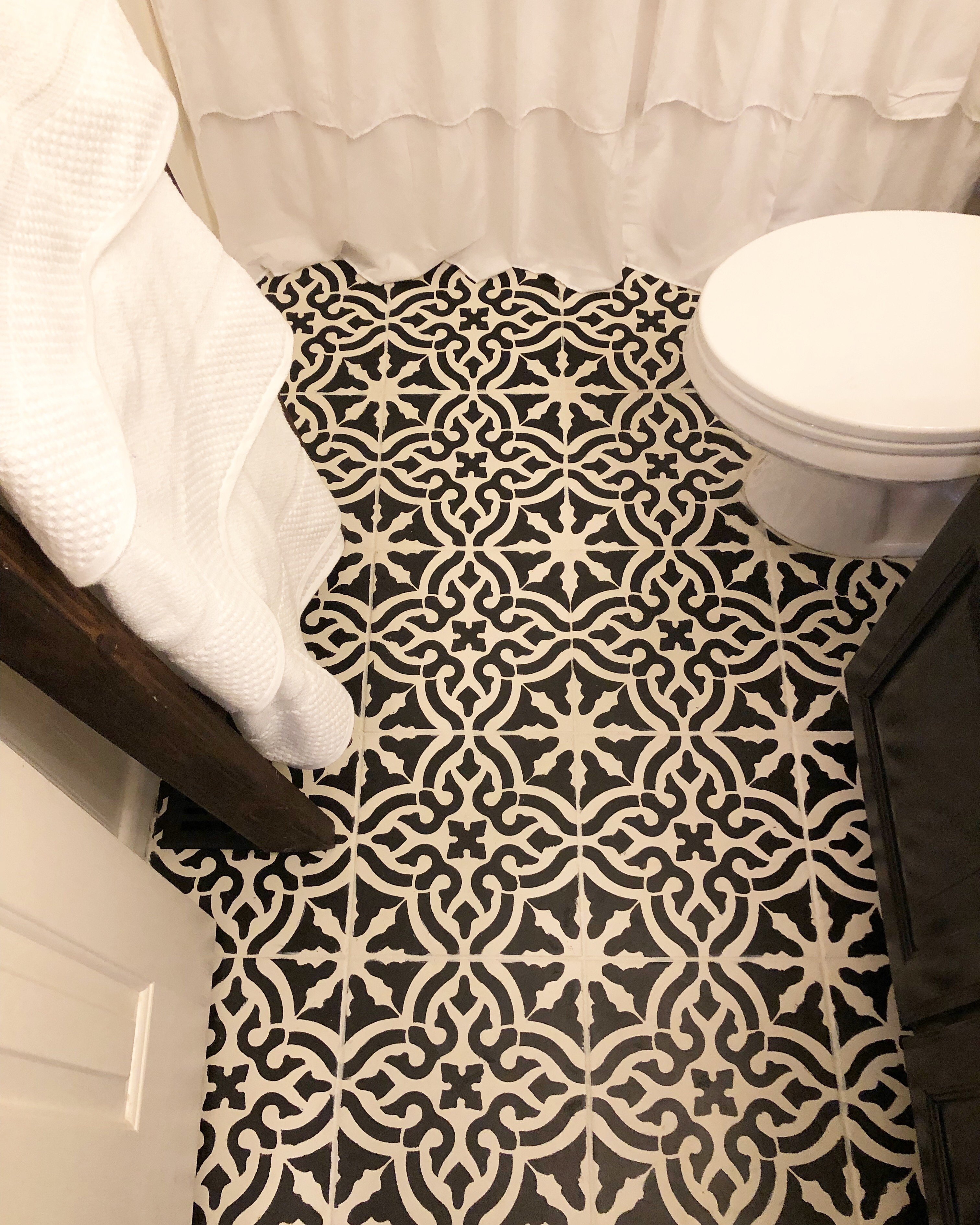 Stenciled ceramic tile floors for the win! Week 4 of the $100 room challenge was a big one!