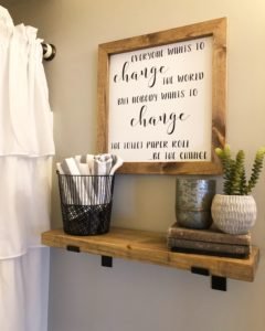 Budget bathroom makeover for the $100 room challenge, funny sign about changing the toilet paper and DIY wood shelf