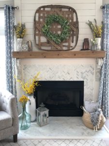 farmhouse fireplace with shiplap, herringbone tile, decor, tobacco basket, belly basket