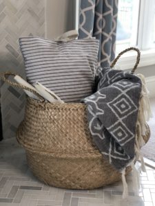 straw belly basket on farmhouse fireplace