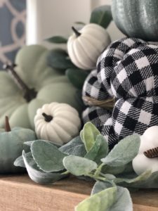DIY Fall painted foam pumpkins with buffalo check and painted pumpkins in muted blue and green chalk paint. A quick, easy and cheap DIY that anyone can do to get the Farmhouse Fall look! I loved mixing in lambs ear and some white pumpkins with this also!