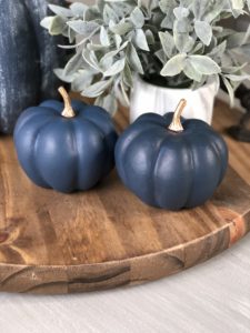 Knock off Target dollar spot pumpkins using dollar tree pumpkins and navy paint for an easy fall diy or craft that anyone can do!