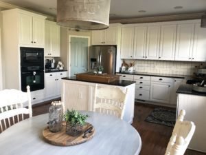 My painted kitchen cabinet makeover! From brown and drab to white and fab! See the before, after and everything in between!