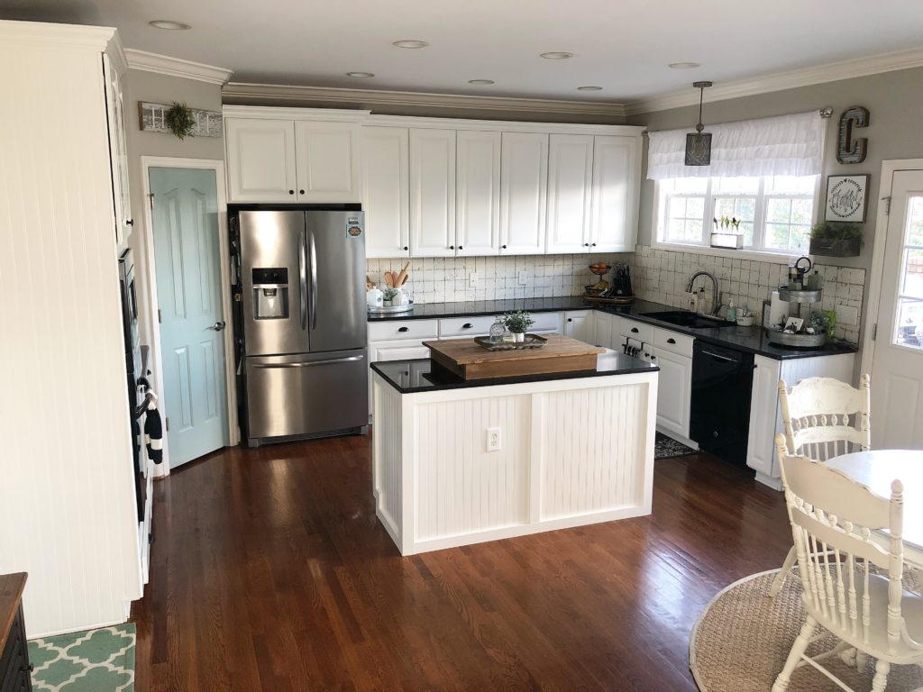 kitchen painted off white with light brown cabinet