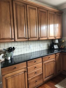 My painted kitchen cabinet makeover, the brown cabinets before they were painted white