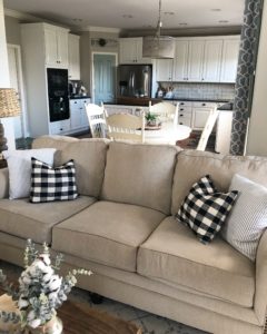 My kitchen cabinet makeover, from brown and drab to white and fab! The view from the living room area of the new painted cabinets!