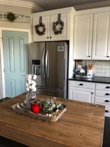 DIY Christmas ornaments using plastic ornaments and real boxwood greenery for a cute look!
