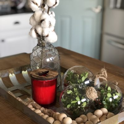 DIY Christmas ornaments with real greenery used in a basket