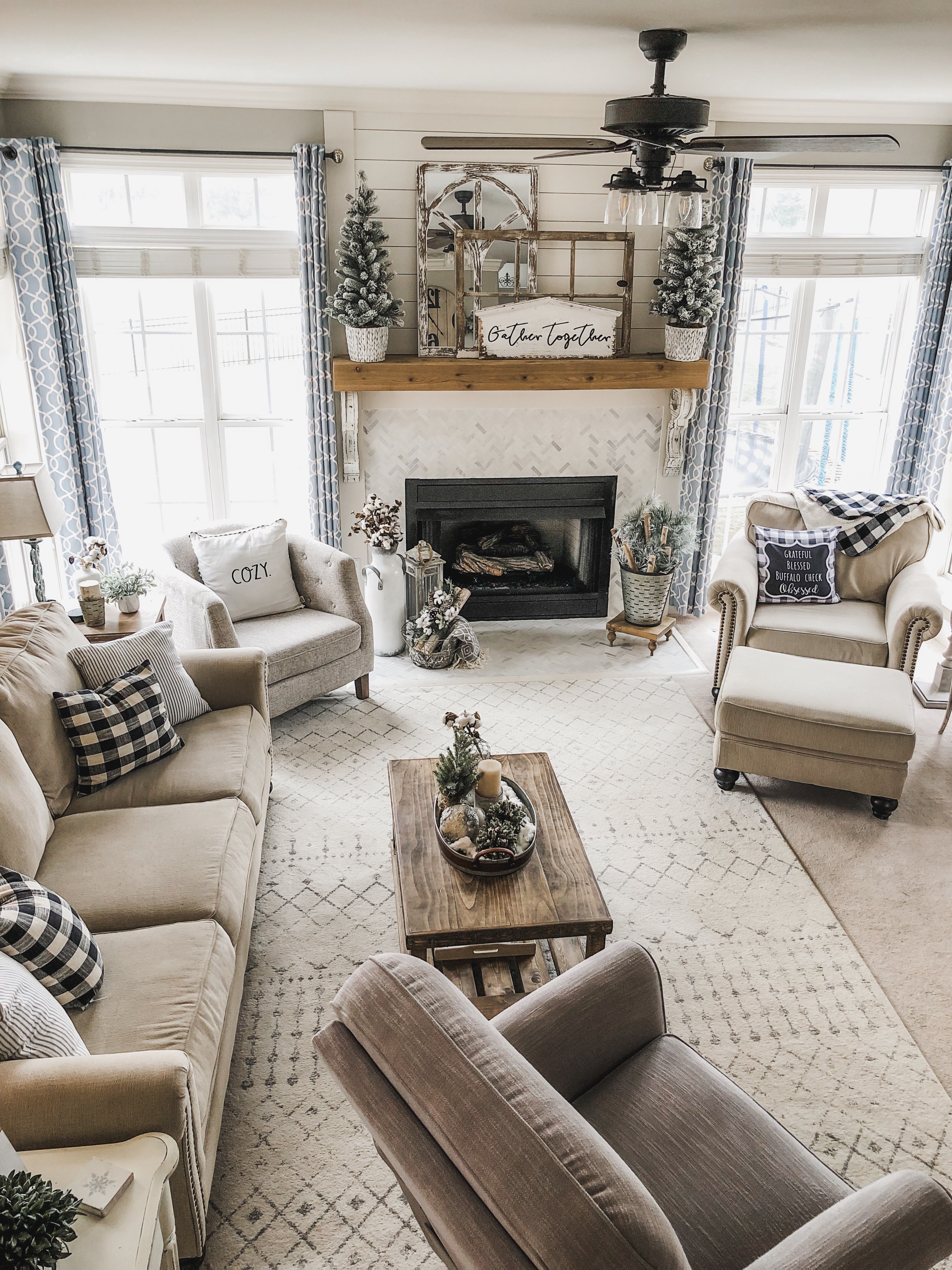 Cozy Winter Living Room decor with flocked greenery, birch logs and