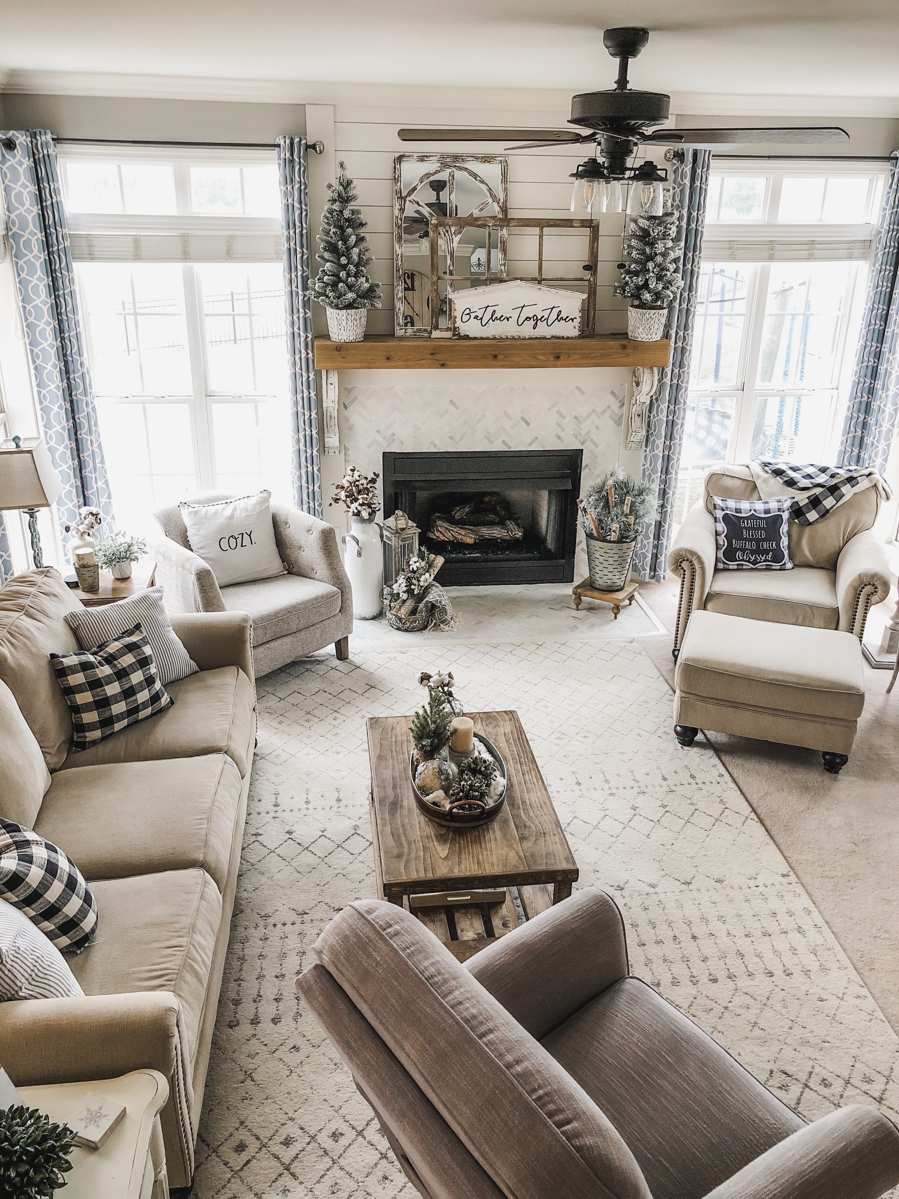 Cozy Winter Living Room decor with flocked greenery, birch logs and cotton  - Wilshire Collections