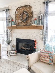 Spring fireplace decorating idea using bright aqua and coral as accent colors for a bold and cheerful look!
