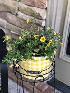 2 hacks to create easy outdoor planters, bucket with holes drilled in the bottom for drainage