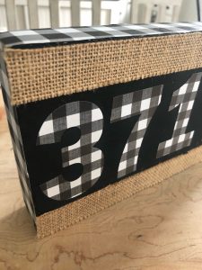 DIY zip code sign using scrap wood and stickers
