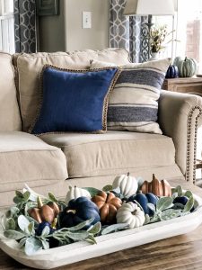 Fall living room ideas using navy, copper and sage green decor!