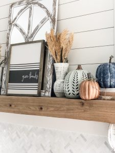 Fall living room ideas using navy, copper and sage green decor!