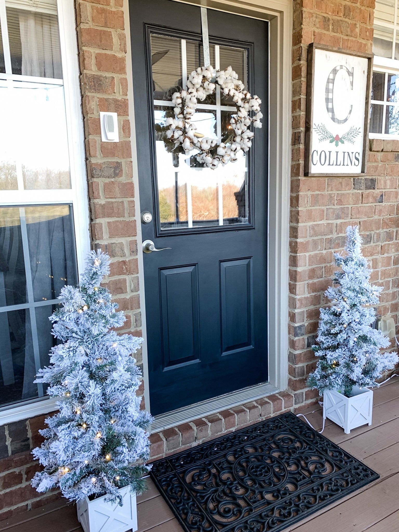 Neutral Christmas decor on the porch for warm and cozy vibes!