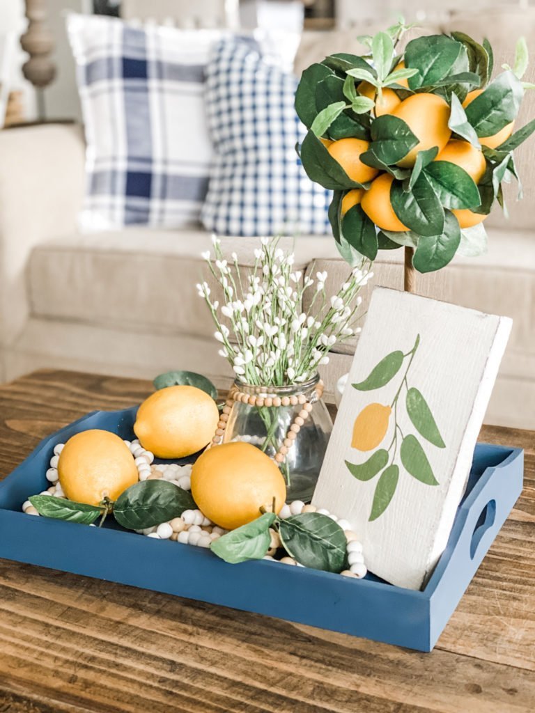 Navy decor in the living room for Spring with yellow accents!