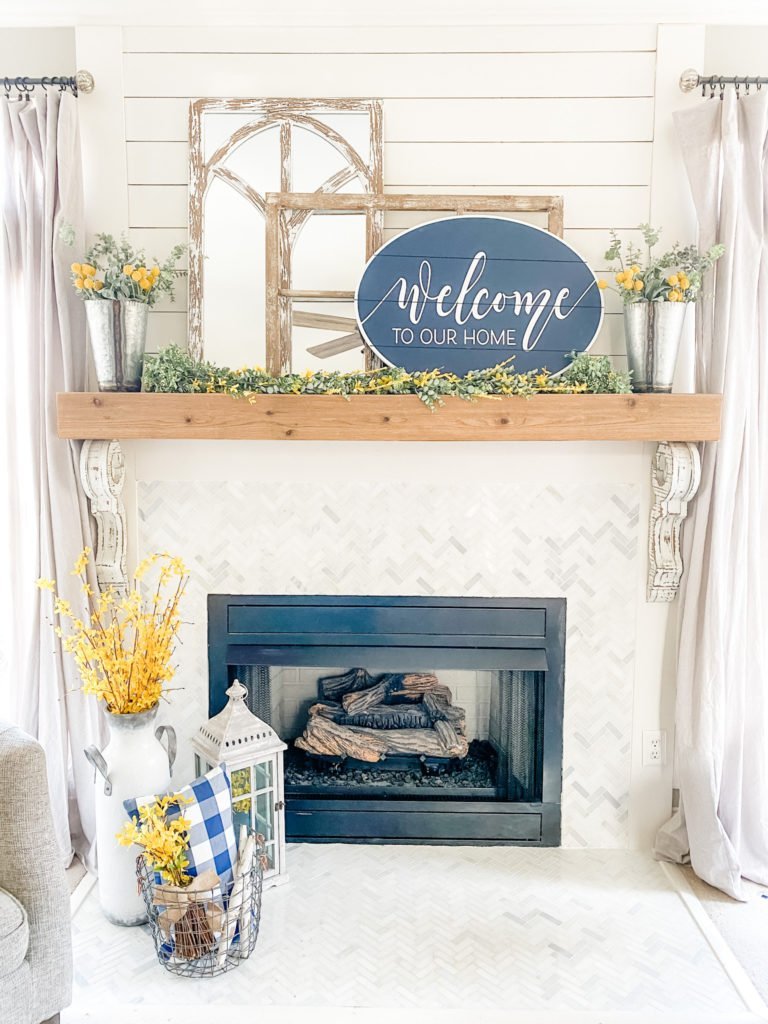 Navy decor in the living room for Spring with yellow accents!