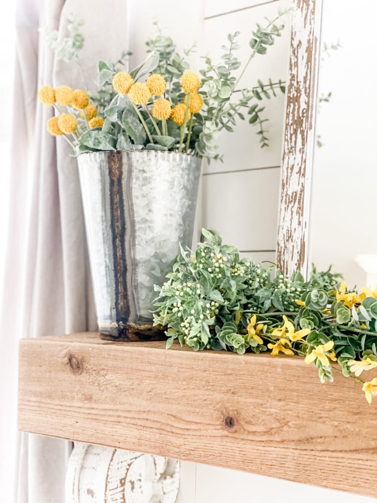 Navy decor in the living room for Spring with yellow accents! 