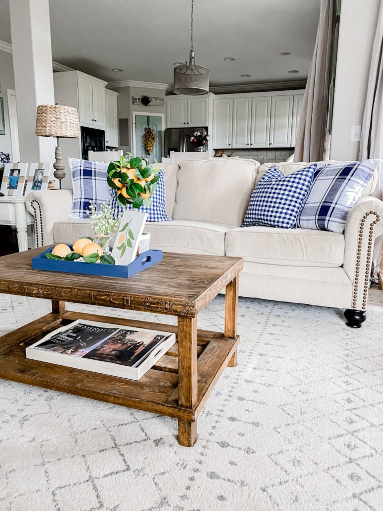 Navy decor in the living room for Spring with yellow accents!