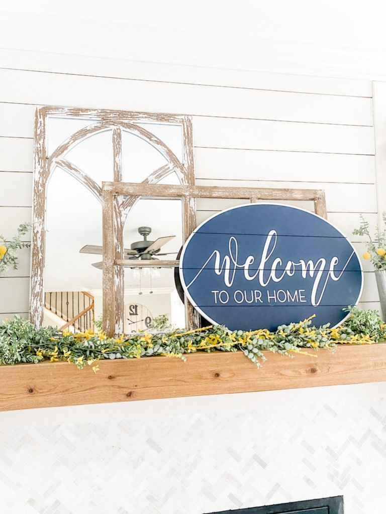 Navy decor in the living room for Spring with yellow accents!