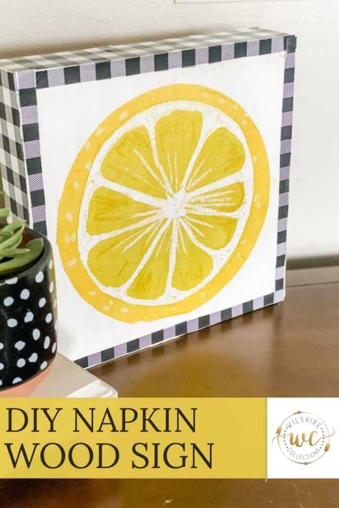 DIY lemon wood sign made with a napkin decoupage technique, displayed with black-and-white buffalo check trim for a cheerful summer decor piece.