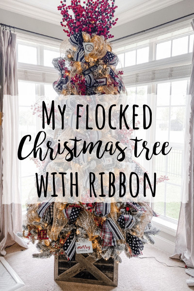 Flocked Christmas tree with ribbon