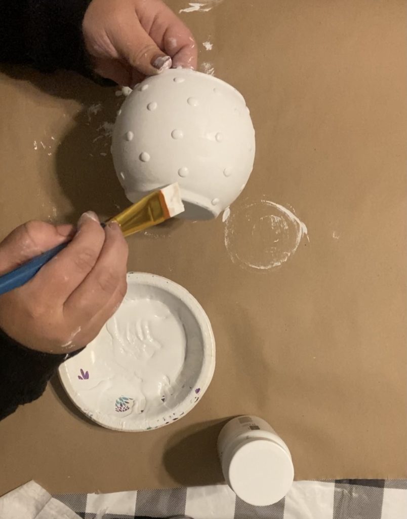 glass vase being painted