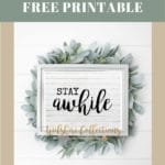 Stay Awhile printable on white shiplap and greenery background