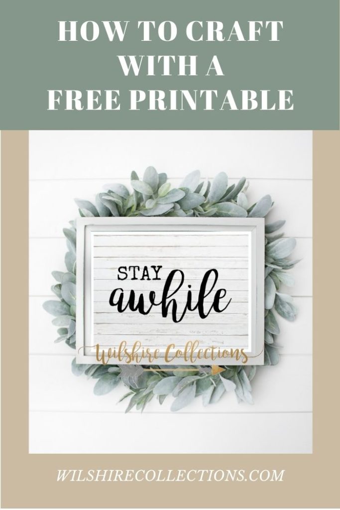 Stay Awhile printable on white shiplap and greenery background