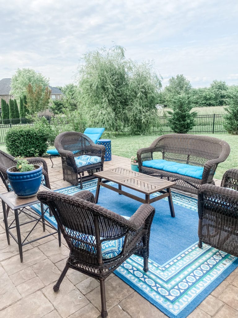 blue and brown wicker backyard sitting area