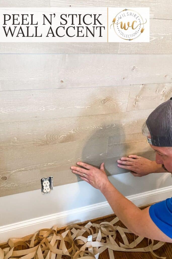 Wood accent wall made with peel and stick panels in a cozy, neutral-toned studio space featuring farmhouse-style decor.