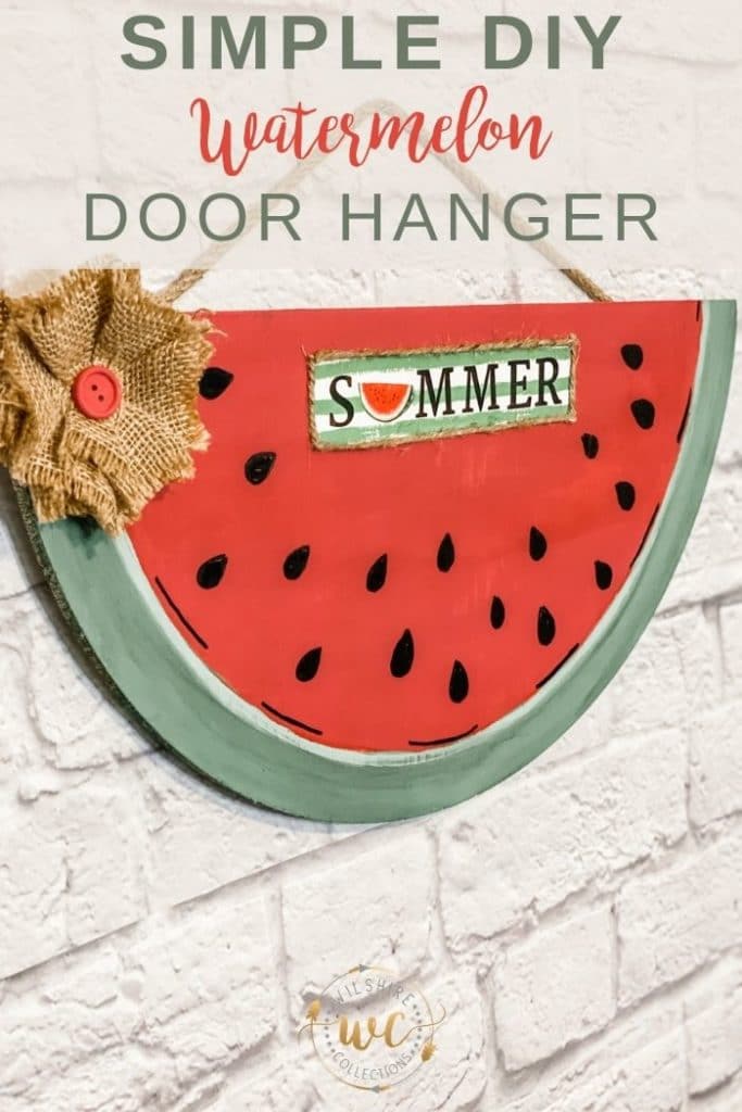 Summer watermelon painted sign with burlap flower hanging on brick wall