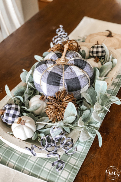 buffalo plaid pumpkin centerpiece on table runner