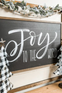 This neutral Christmas decor with buffalo check is truly a gorgeous combo for the holidays and will go with so many decorating styles too!