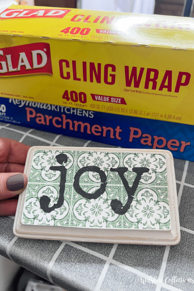 Decoupage hack using cling wrap instead of mod podge!