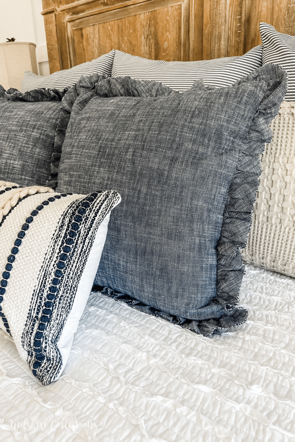 Neutral and Navy bedding idea - Wilshire Collections
