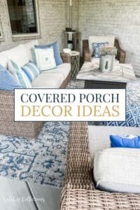 Cozy covered porch decorated with neutral wicker furniture, blue and white patterned pillows, an outdoor rug, and a modern fire table—inviting space for relaxing or entertaining.