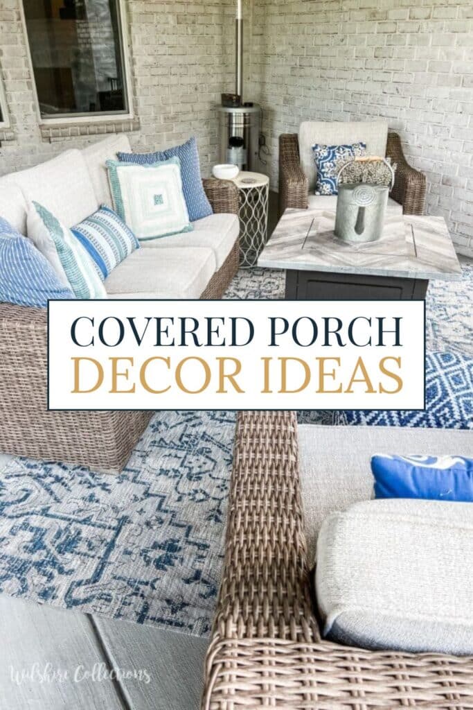 Cozy covered porch decorated with neutral wicker furniture, blue and white patterned pillows, an outdoor rug, and a modern fire table—inviting space for relaxing or entertaining.