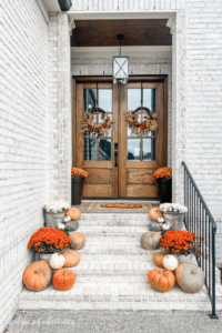 Fall front porch cascading pumpkins