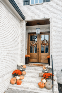 Fall front porch cascading pumpkins
